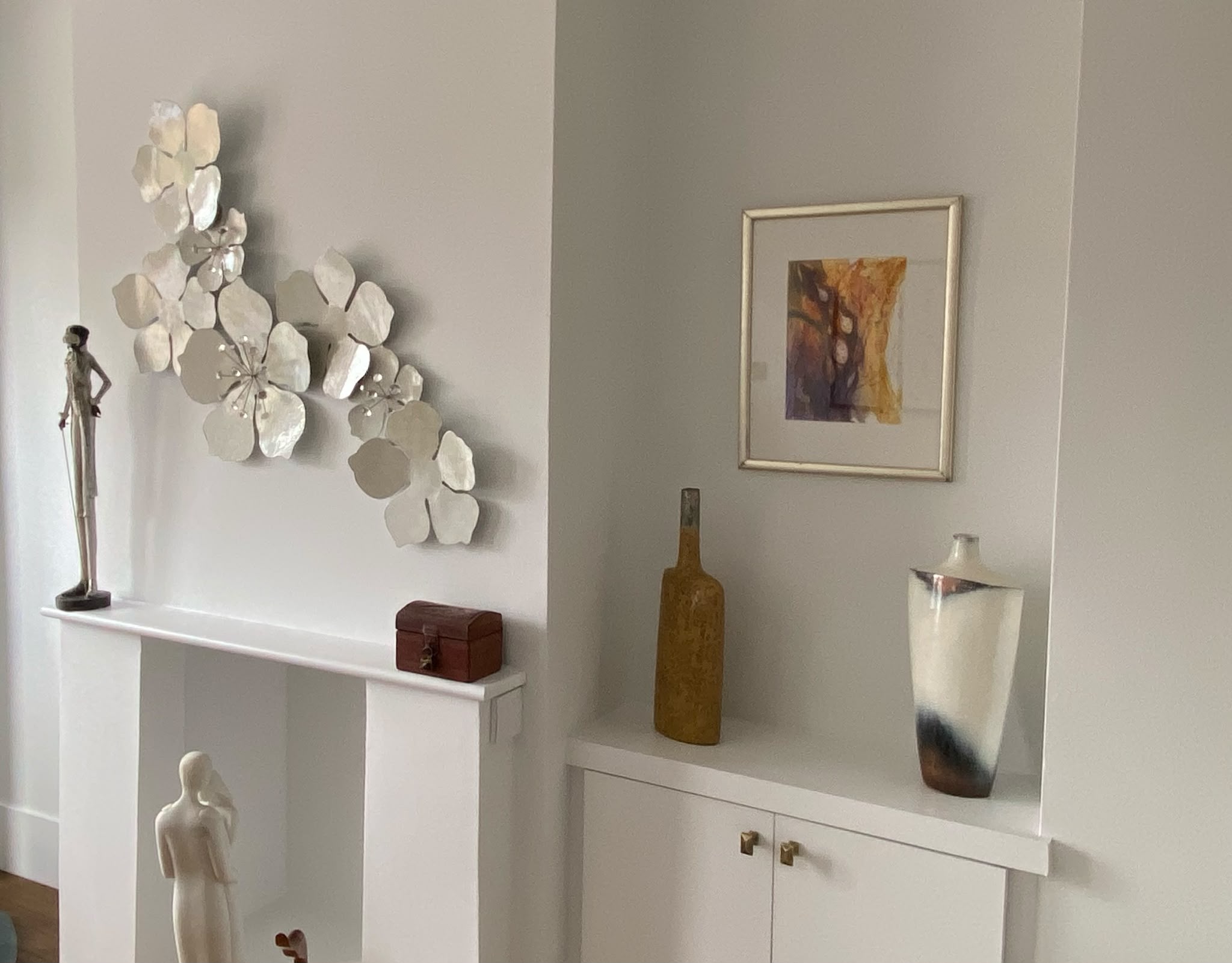 Precisely installed framed artwork and decorative wall pieces